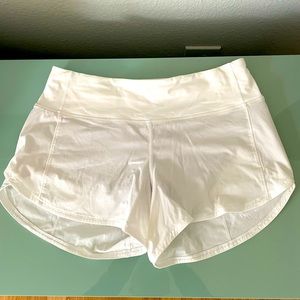 Lululemon 'Speed Up' style, white size 6 lined short. 4" inseam